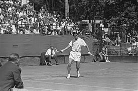 Roy Emerson, an Australian former tennis player who won 12 Grand Slam singles titles and 16 Grand Slam doubles titles, for a total of 28 Grand Slam titles.